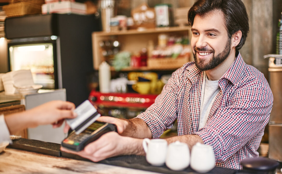 You feel alive to the degree that you feel you can help others. Small business, payment, people and service concept - woman with credit card buying coffee at cafe or coffee shop