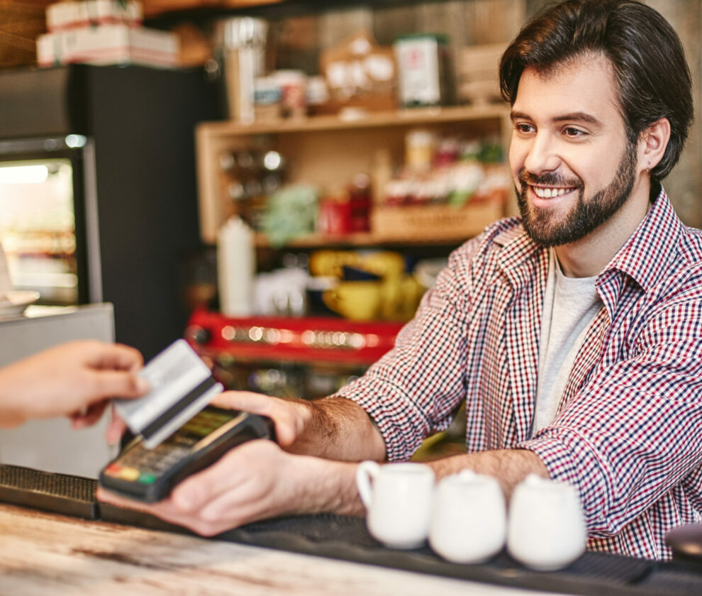 You feel alive to the degree that you feel you can help others. Small business, payment, people and service concept - woman with credit card buying coffee at cafe or coffee shop